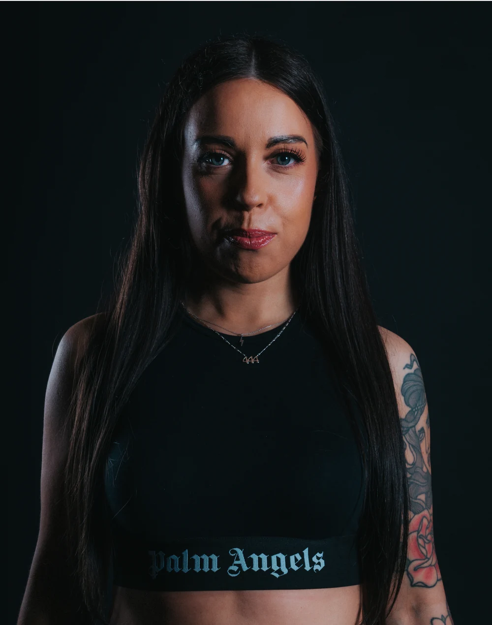 Hannah Taylor in black, from her official artist photoshoot
